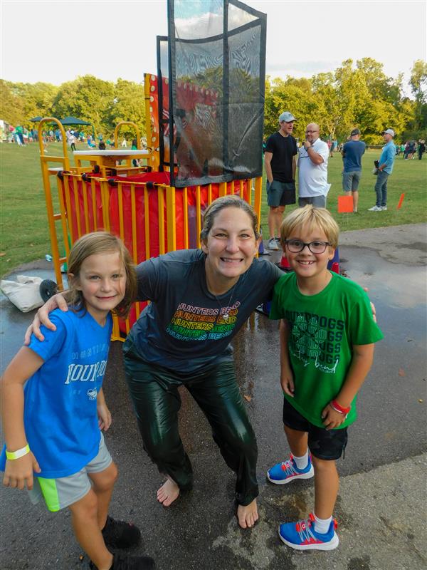 Students outside enjoying a family fun night for their school.